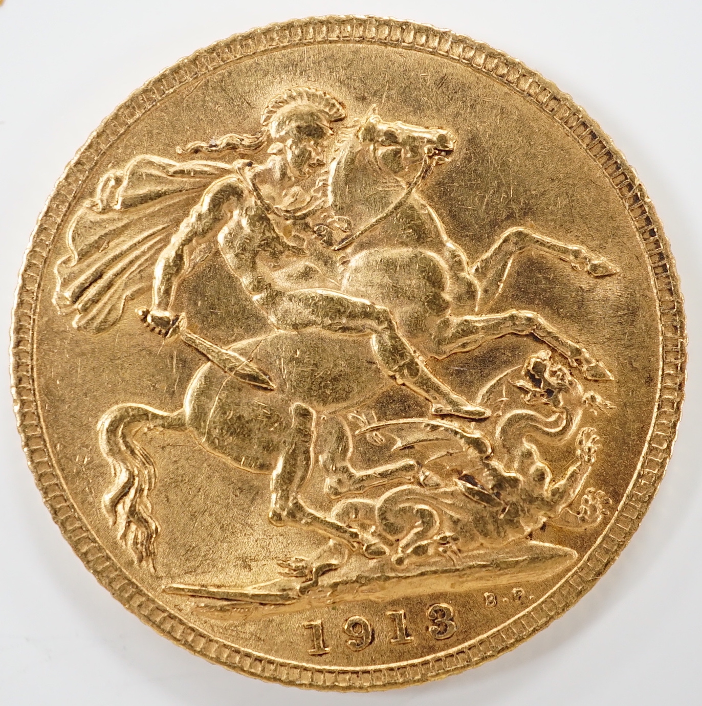 A George V 1915 gold sovereign.